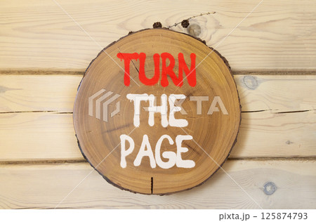 Turn the page symbol. Concept words Turn the page on beautiful wooden circle. Beautiful wooden wall background. Business motivational lifestyle turn the page concept. Copy space. Turn the page symbol. Concept words Turn the page on beautiful wooden circle. Beautiful wooden wall background. Business motivational lifestyle turn the page concept. Copy space. 125874793