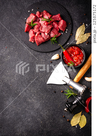 Raw beef meat and ingredients for cooking 125875172