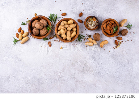 Assortment of different nuts and seeds 125875180