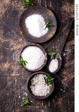 Natural sea salt crystals on dark background 125875195