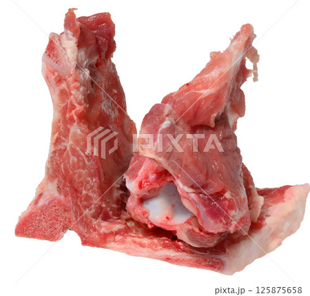 A cut section of raw pork bones with some attached meat and fat, isolated background 125875658