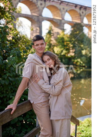 Young Cute Female Hugs Boyfriend. In Autumn Outdoor. Lovers Walking in Park. Attractive Funny Couple. Lovestory in Forest. Man and Woman. Cute Lovers in the Park. Family Concept. Happy Couple. 125875952