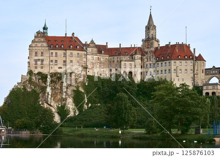 Majestic Sigmaringen Castle Perched on Rugged Cliff Above Tranquil Danube: Historic Hohenzollern Residence Showcases Medieval Architecture and Royal Collections in Picturesque Baden-Wurttemberg 125876103