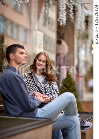 Young Cute Female Hugs Boyfriend. In Autumn Outdoor. Lovers Walking in Park. Attractive Funny Couple. Lovestory in Forest. Man and Woman. Cute Lovers in the Park. Family Concept. Happy Couple. 125876124