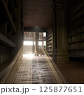 Narrow university library aisle with tall shelves, wooden flooring and bright sunlight shining through windows. Dark reading corner with empty desk creating calm space for studying 125877651