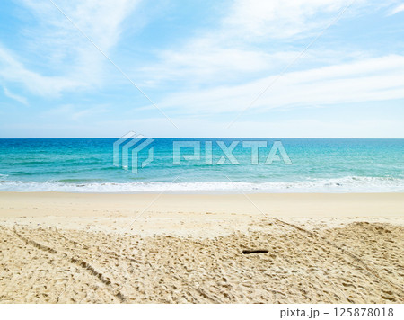 Beautiful sandy beach and sea in sunny day,Blue sky in good weather day, Beach sea space area nature background Beautiful sandy beach and sea in sunny day,Blue sky in good weather day, Beach sea space area nature background 125878018