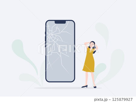 スマホの画面がバキバキに割れてショックを受ける若い女性 125879927