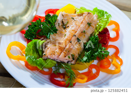 Delicious roasted juicy trout fillet 125882451