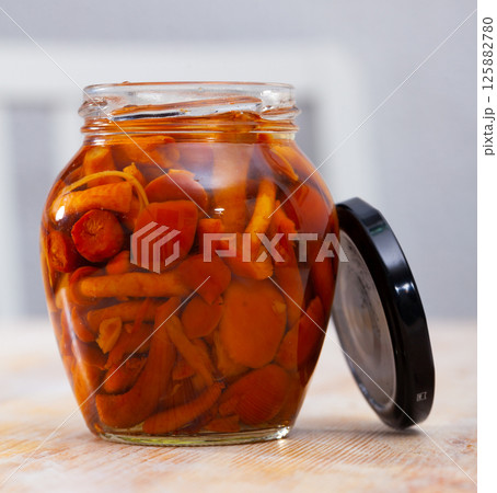 Marinated honey fungi in glass jar 125882780