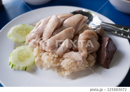 Delicious chicken rice dish southeast asia food vibrant setting close-up view culinary delight Delicious chicken rice dish southeast asia food vibrant setting close-up view culinary delight 125883072