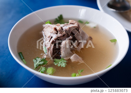 Delicious savory soup local eatery food dish cozy setting close-up view culinary delight Delicious savory soup local eatery food dish cozy setting close-up view culinary delight 125883073