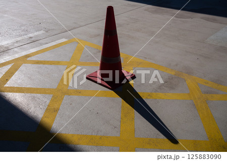 Traffic safety alert parking cone highlighting caution urban environment 125883090