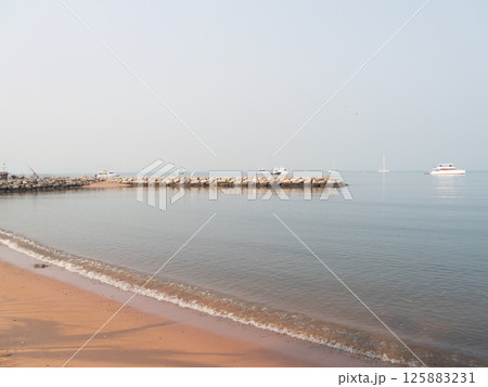 Calm morning the beach scenic waterfront serene environment wide view tranquility Calm morning the beach scenic waterfront serene environment wide view tranquility 125883231