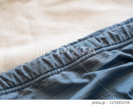 Exploring comfortable swimwear fabric detailed indoor textiles a cozy environment Exploring comfortable swimwear fabric detailed indoor textiles a cozy environment 125883256