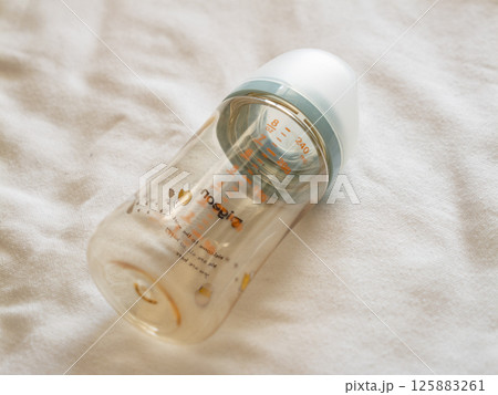 Infant feeding essentials home setting product soft textiles close-up focus baby care concepts Infant feeding essentials home setting product soft textiles close-up focus baby care concepts 125883261