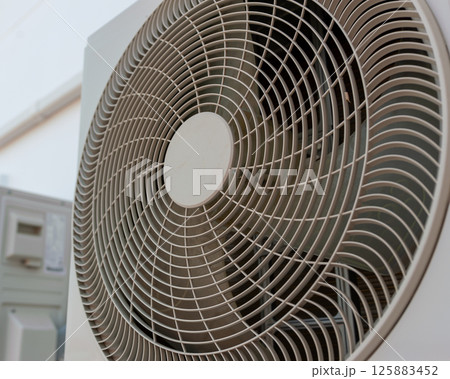 Air conditioning unit operation indoor setting product modern environment close-up comfort concept Air conditioning unit operation indoor setting product modern environment close-up comfort concept 125883452