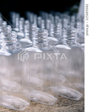 Row of plastic PET Bottles Production Line - Ready for Bottling. Row of plastic PET Bottles Production Line - Ready for Bottling. 125885082