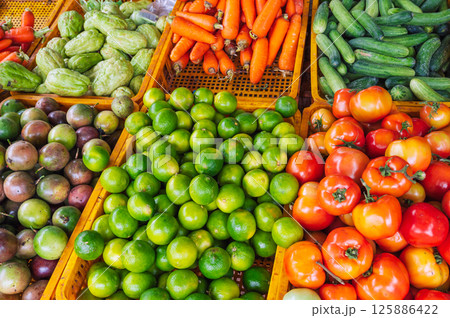 assortment of fresh vegetables on the counter at grocery farmers market 125886422