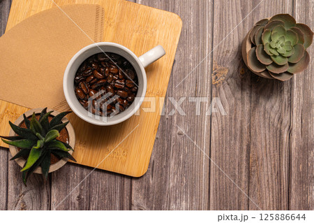 Coffeebeans in cup. Coffeebeans in cup. 125886644