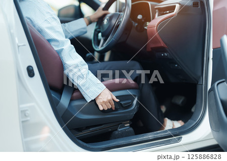Business woman hand adjust car seat before drive on the road. Ergonomic, health  care and safety transportation concept 125886828