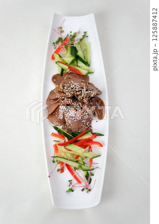 Food tray with delicious salami, ham, fresh sausages and herbs. Meat platter with selection. Food tray with delicious salami, ham, fresh sausages and herbs. Meat platter with selection. 125887412