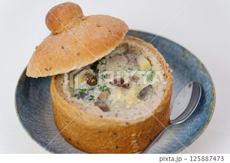 Homemade Broccoli Cheddar Soup in a Bread Bowl Ready to Eat Homemade Broccoli Cheddar Soup in a Bread Bowl Ready to Eat 125887473