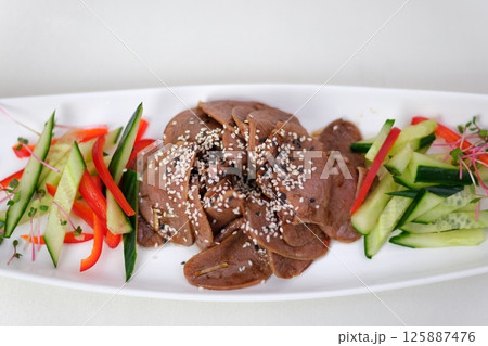 Liver cucumber peppers Tasty fried chicken liver with onion and parsley isolated on white Liver cucumber peppers Tasty fried chicken liver with onion and parsley isolated on white 125887476