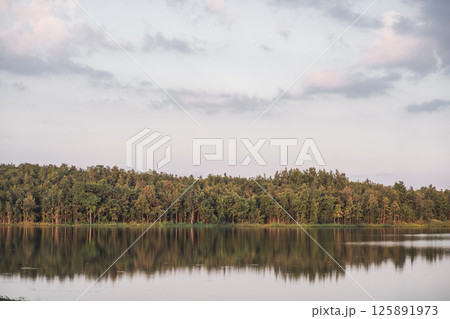 travel and people activity concept with twilight sky with reflection of mountain on lake before sunset 125891973