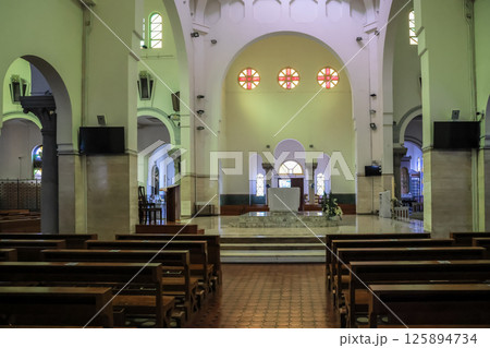 May 5 2025 View of a Church with Arched Architecture and Stained Glass Windows 125894734