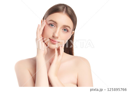 A beautiful young woman with clean, fresh skin against a white background. Skincare, facial treatment, cosmetology, beauty, and spa. An elegant portrait of an woman. A beautiful young woman with clean, fresh skin against a white background. Skincare, facial treatment, cosmetology, beauty, and spa. An elegant portrait of an woman. 125895766