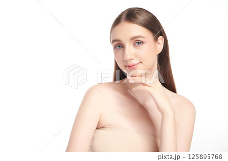 A beautiful young woman with clean, fresh skin against a white background. Skincare, facial treatment, cosmetology, beauty, and spa. An elegant portrait of an woman. A beautiful young woman with clean, fresh skin against a white background. Skincare, facial treatment, cosmetology, beauty, and spa. An elegant portrait of an woman. 125895768