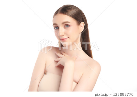 A beautiful young woman with clean, fresh skin against a white background. Skincare, facial treatment, cosmetology, beauty, and spa. An elegant portrait of an woman. A beautiful young woman with clean, fresh skin against a white background. Skincare, facial treatment, cosmetology, beauty, and spa. An elegant portrait of an woman. 125895770