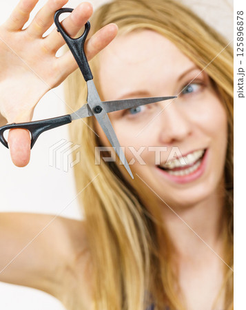Woman with scissors ready to hair cutting 125896878