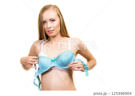 Woman choosing underwired bra Woman choosing underwired bra 125896904