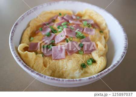 creamy omelet or omelet or omelette or fried egg with ham and green onion 125897037