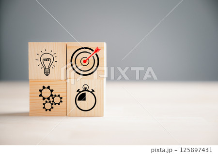 Wooden block step with Action Plan, Goal, and Target icons. Success and business target concept. Company strategy and project management on a table. Marketing background. Wooden block step with Action Plan, Goal, and Target icons. Success and business target concept. Company strategy and project management on a table. Marketing background. 125897431