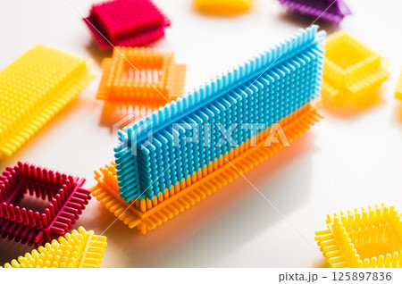 The children's construction toy is presented as a set of parts that can be transformed into various objects. The children's construction toy is presented as a set of parts that can be transformed into various objects. 125897836
