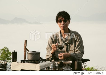 Morning coffee concept of cafe focus on nurturing coffee in harmony with nature organic seed create warm cup caffeine background green fresh great outdoor. aromatic drink rich aroma of rising from mug 125898074