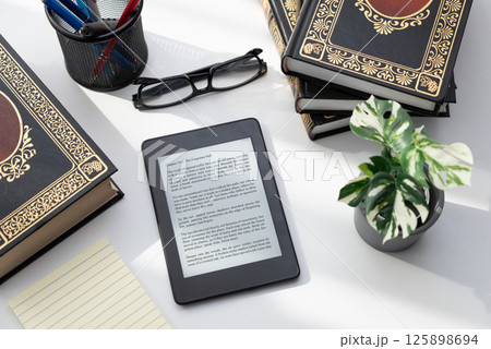 E-book reader device in home library 125898694