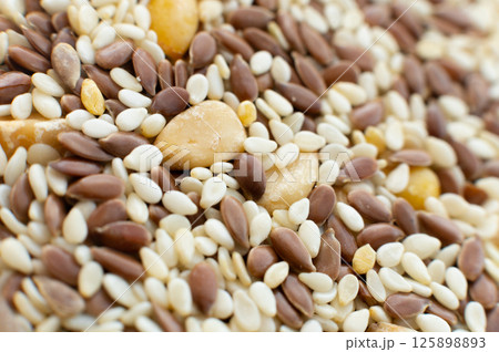 pile of sesame, flax and chickpea seeds. Macro shot of a salad dressing kit with healthy seeds pile of sesame, flax and chickpea seeds. Macro shot of a salad dressing kit with healthy seeds 125898893