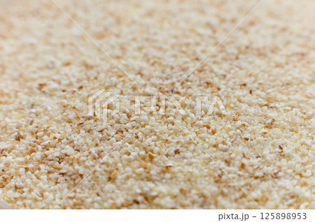 Close-up of raw semolina background in macro mode and soft focus Close-up of raw semolina background in macro mode and soft focus 125898953