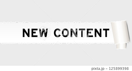Ripped gray paper background that have word new content under torn part 125899398