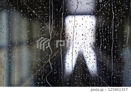 Raindrops on Window Glass with Soft Focus. Moody Rainy Day Texture Raindrops on Window Glass with Soft Focus. Moody Rainy Day Texture 125901357