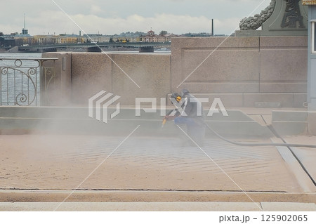 blast cleaning, man working in the dust blast cleaning, man working in the dust 125902065