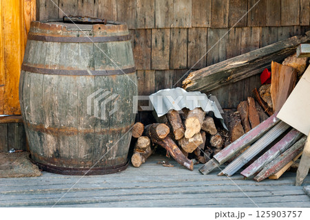 Rustic Barrel and Woodpile 125903757