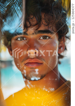 Young man reflecting amidst tropical sunset with a serene and inspiring backdrop. Young man surfer at sunset, surrounded by tropical imagery and vibrant colors. Double exposure 125904377