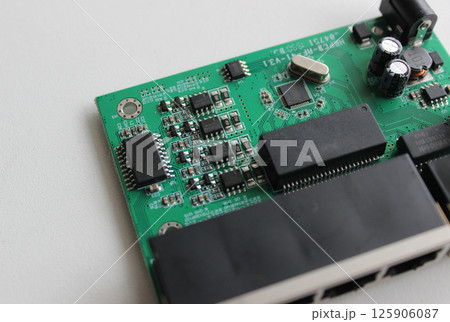 Main network switch circuit board with four soldered controllers for network connection slots Main network switch circuit board with four soldered controllers for network connection slots 125906087