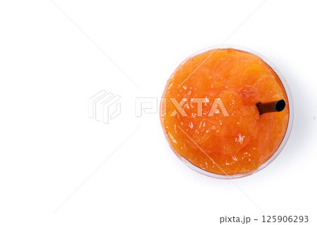 Orange slushie isolated on white background. Top view. Copy space 125906293