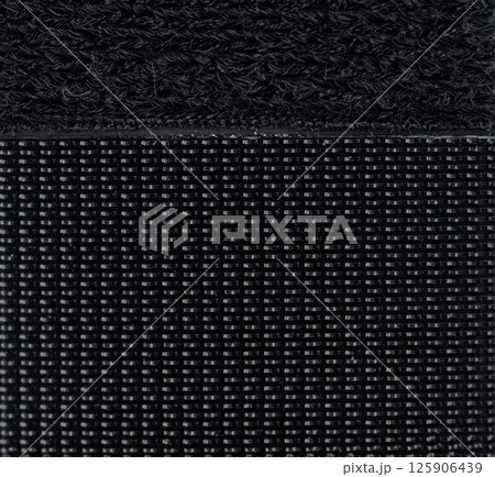 Black fabric texture with distinct weaving patterns showing close-up details and quality Black fabric texture with distinct weaving patterns showing close-up details and quality 125906439