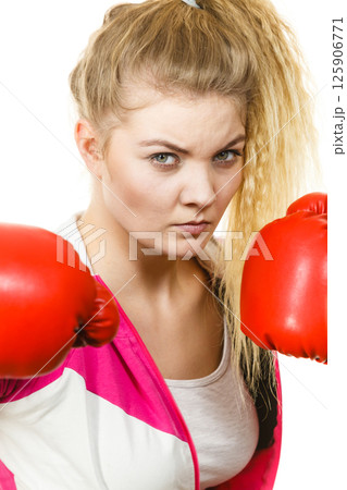 Woman wearing boxing gloves Woman wearing boxing gloves 125906771